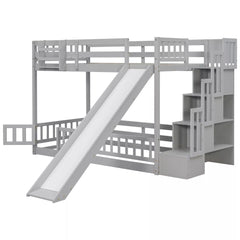 Front angled view of gray twin over twin bunk bed with slide and staircase storage