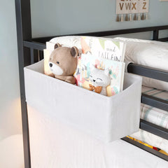 Hanging storage bag on kids loft bed guardrail for small items