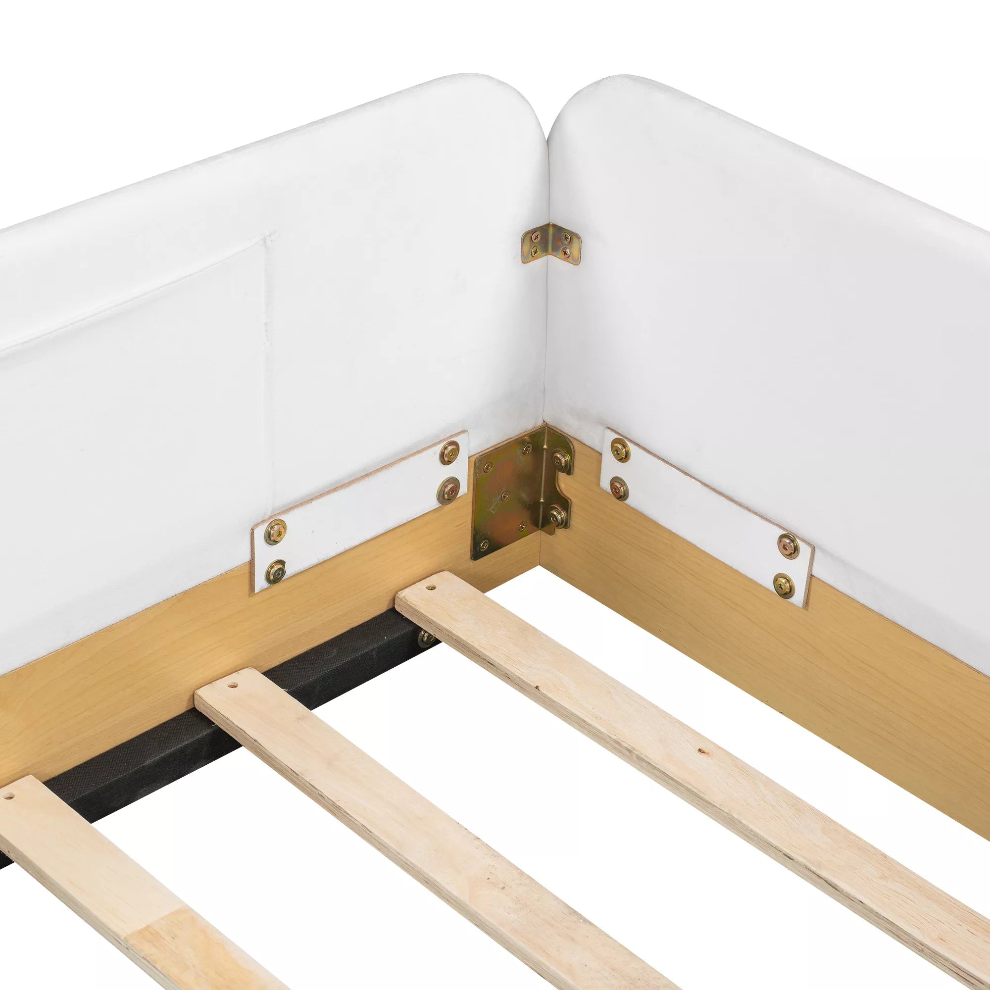 Close-up of corner joints on white upholstered platform bed guardrails