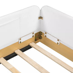 Close-up of corner joints on white upholstered platform bed guardrails