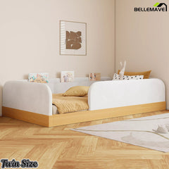 White twin upholstered platform bed with natural wood-look base in a bedroom